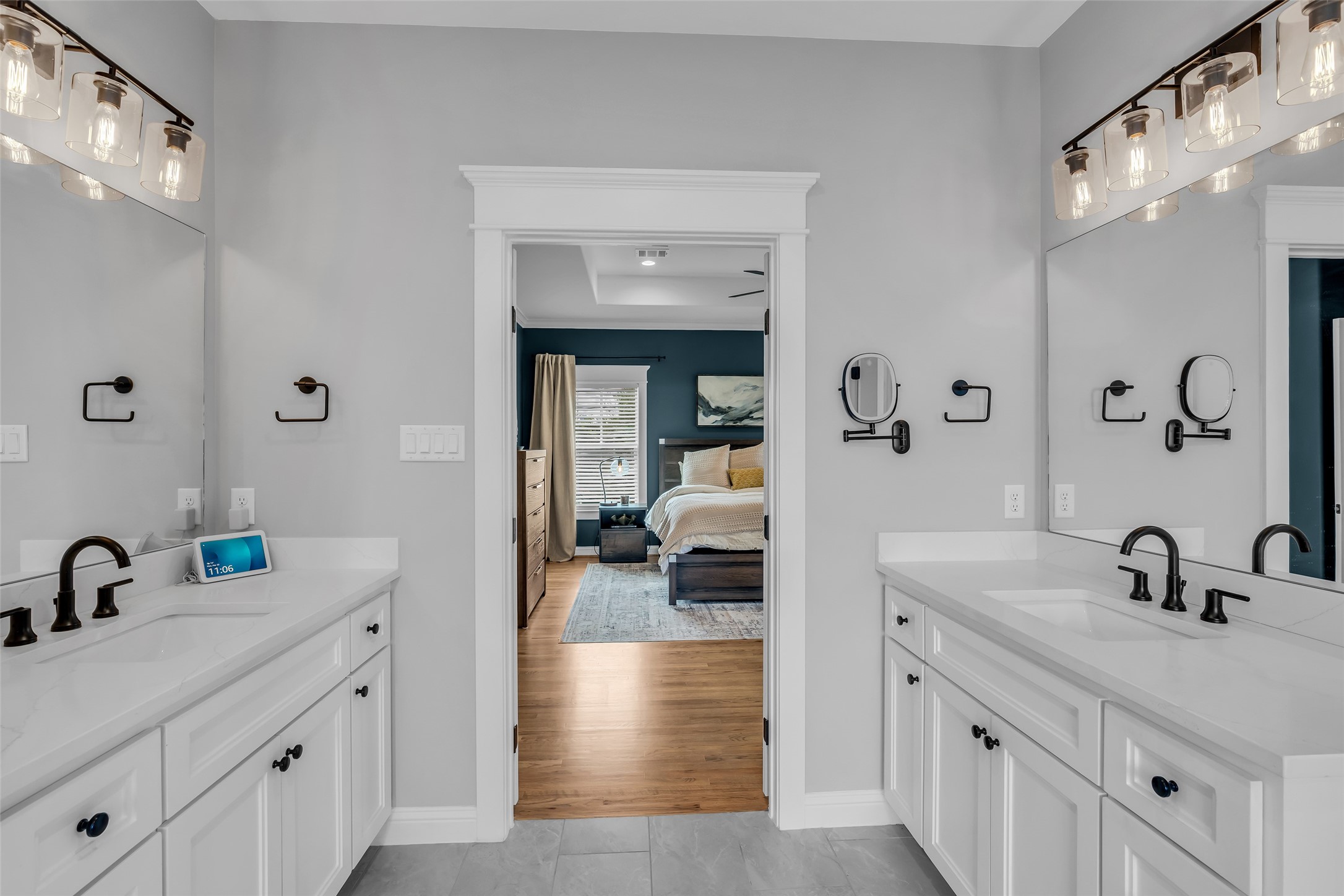 800 Walton Street Houston, TX 77009 - Photo 27 of 38 The primary bathroom includes two sinks and cabinets, providing plenty of storage and convenience for daily routines.