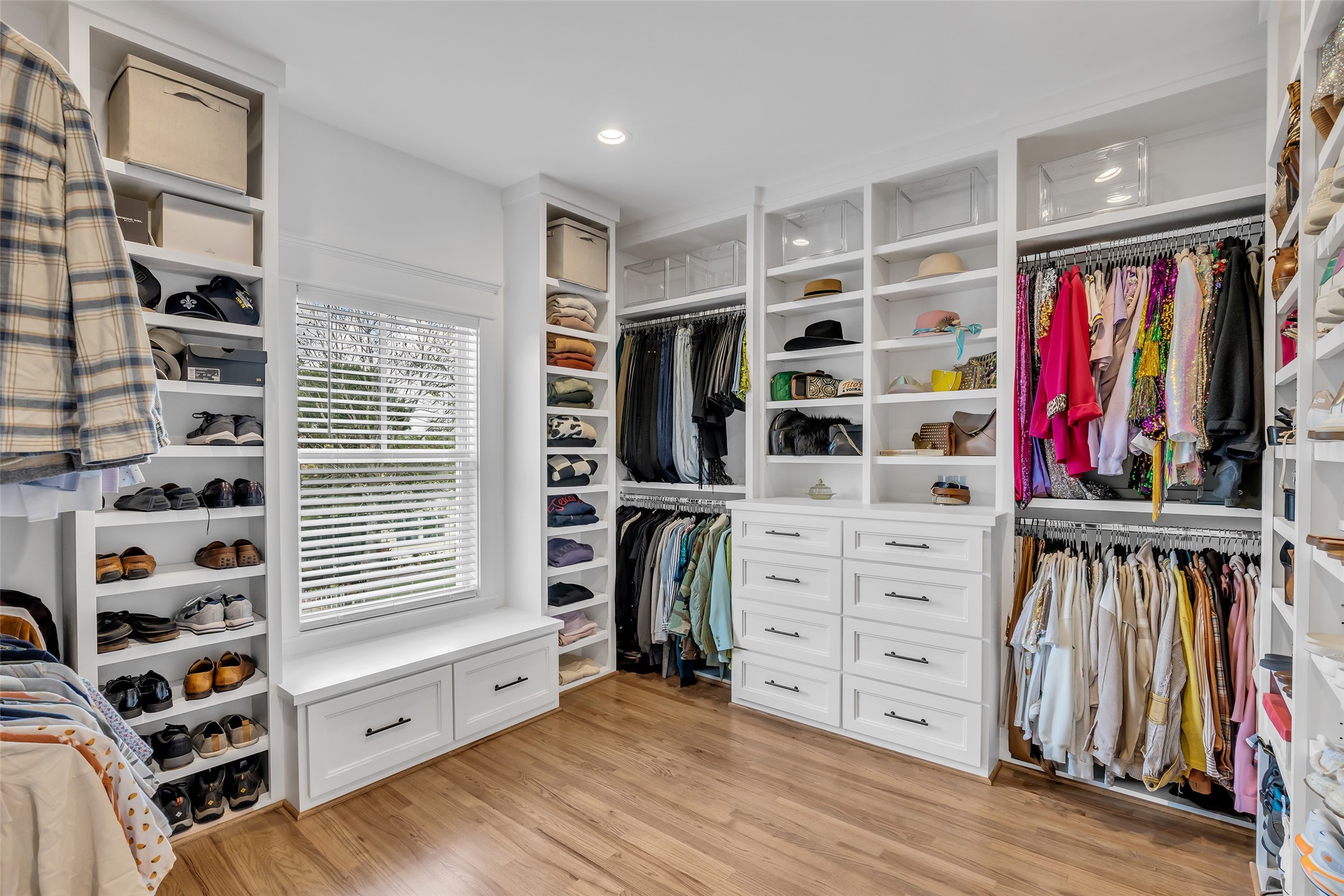 800 Walton Street Houston, TX 77009 - Photo 29 of 38 The spacious walk-in closet includes built-in shelves and drawers, making organization easy and efficient.