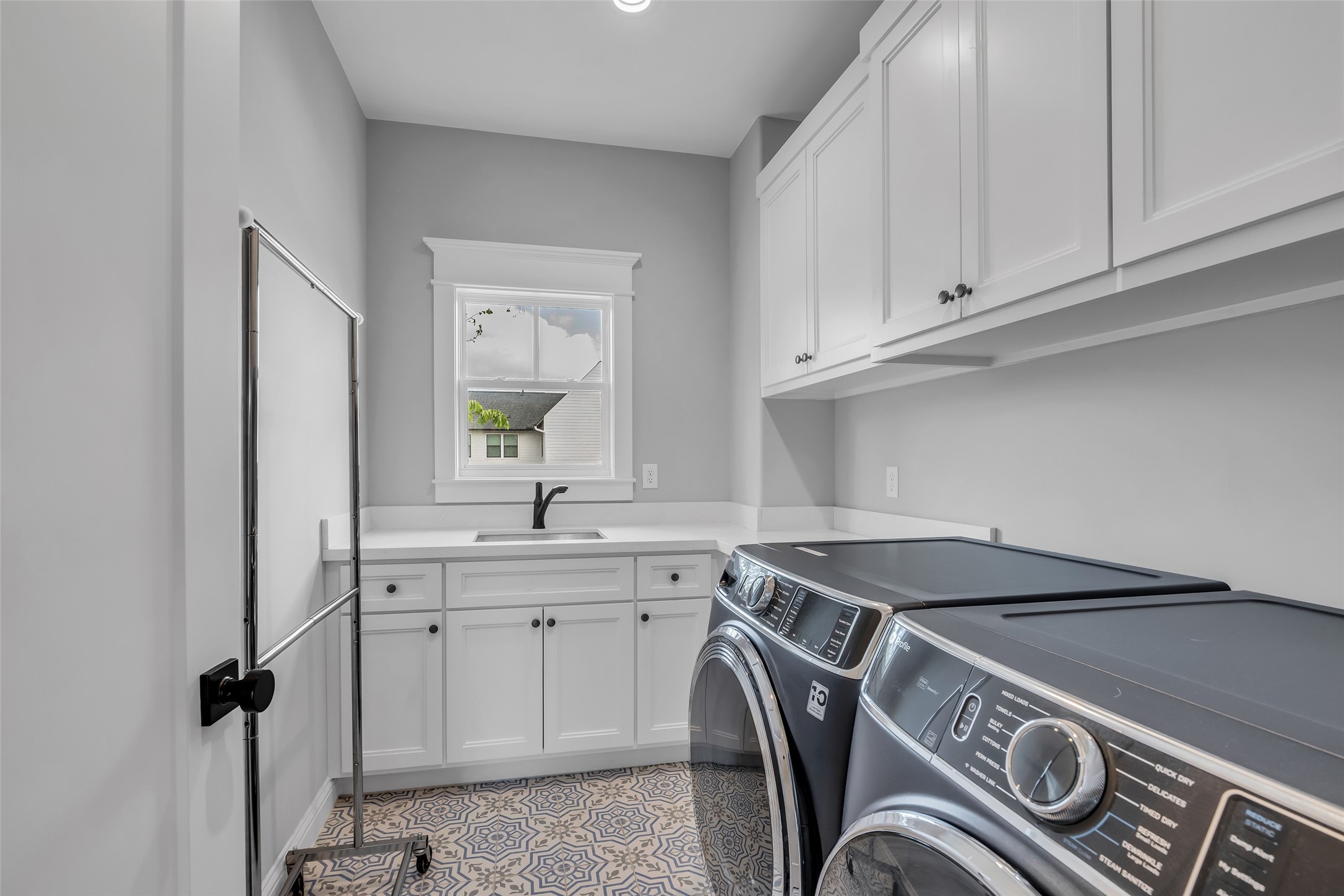 800 Walton Street Houston, TX 77009 - Photo 33 of 38 The laundry room includes electric and gas dryer connections, washer hookups, and plenty of storage space for added convenience.