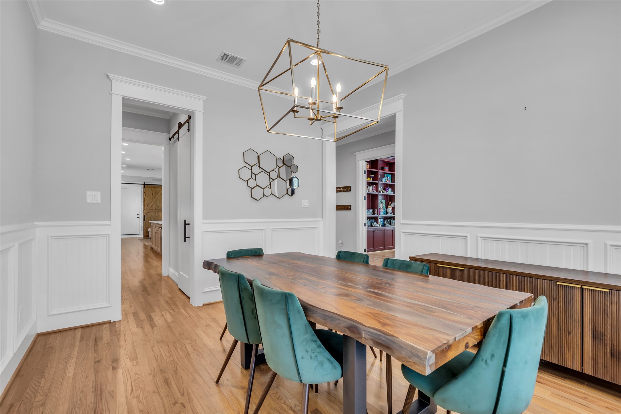 800 Walton Street Houston, TX 77009 - Photo 7 of 38 This view of the formal dining room highlights the doors that lead to the kitchen and other areas of the home, creating an open and accessible flow between spaces.