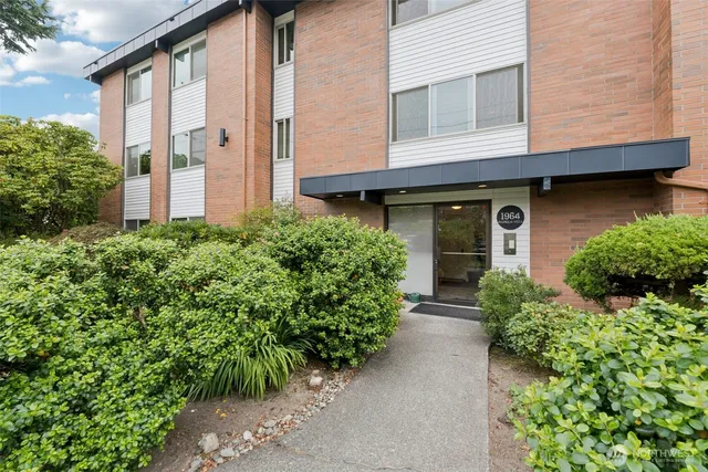 front view of a house with potted plants