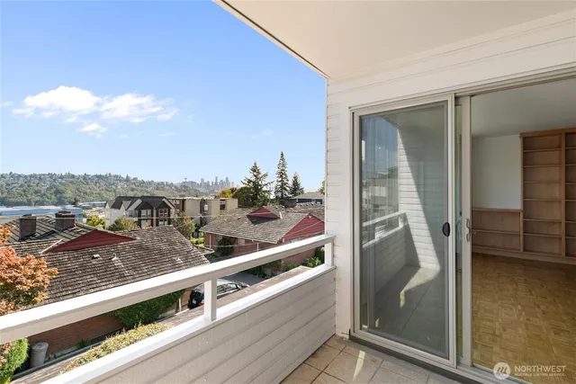 a view of a balcony with an outdoor seating