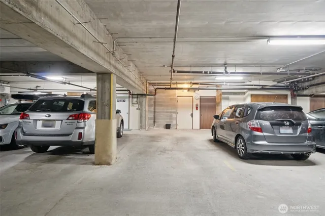 a view of parking garage with cars