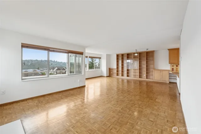 a view of an empty room with a window