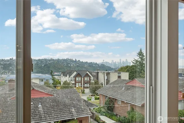a view of a balcony with floor to ceiling windows yard and mountain view