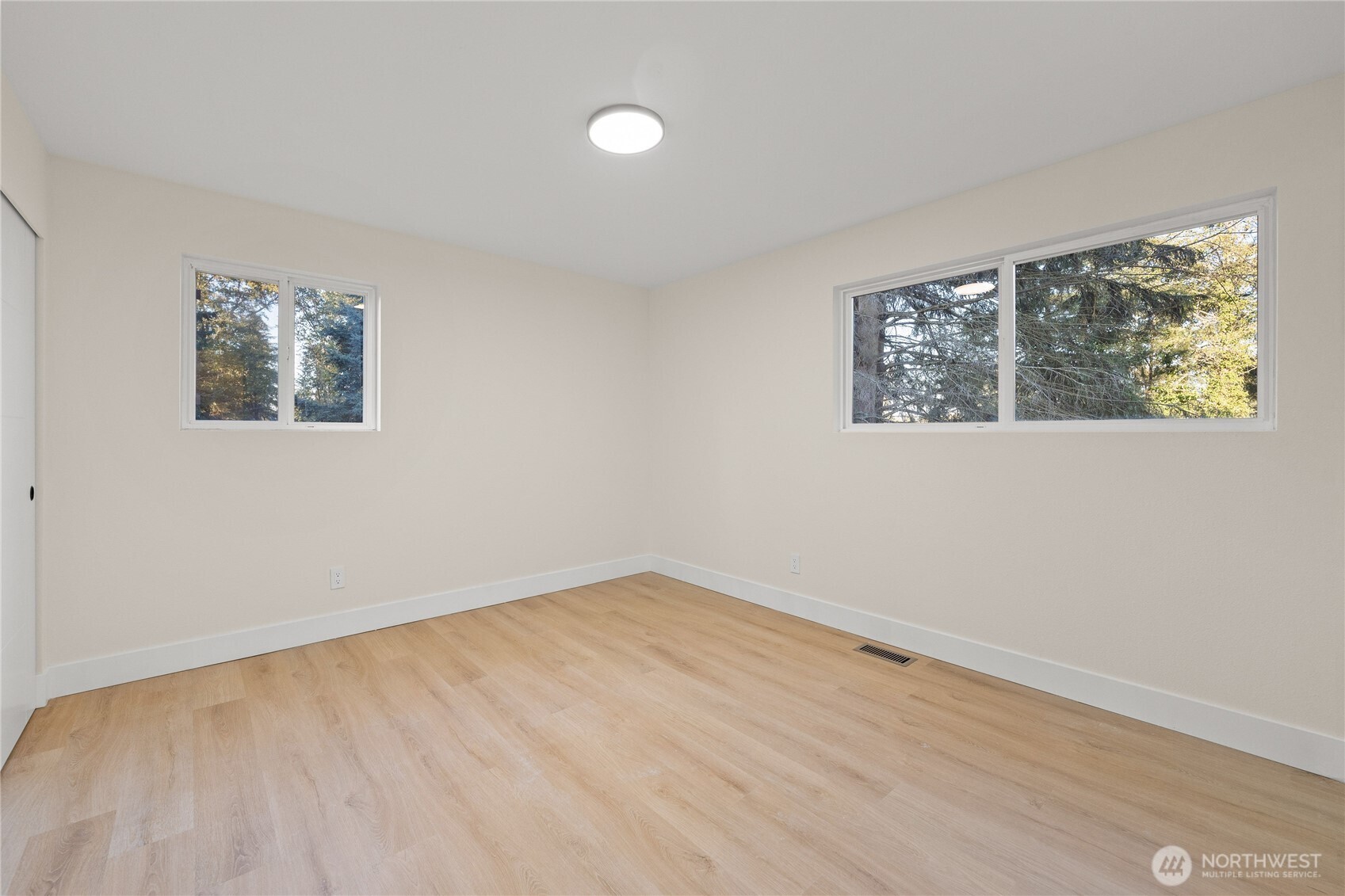 29628 22nd Avenue South Federal Way, WA 98003 - Photo 13 of 40 wooden floor in an empty room with a window