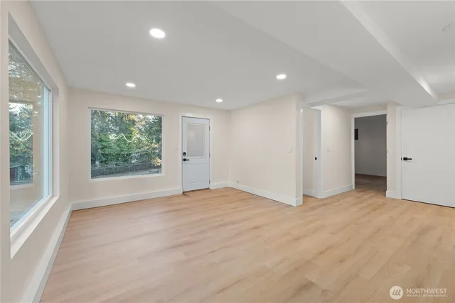 a view of an empty room with a window