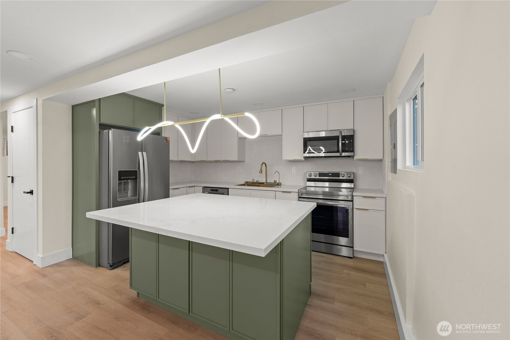 29628 22nd Avenue South Federal Way, WA 98003 - Photo 29 of 40 a kitchen with a stove a sink and a refrigerator