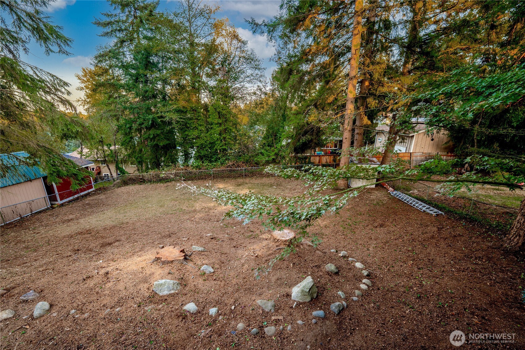 29628 22nd Avenue South Federal Way, WA 98003 - Photo 40 of 40 a view of a dirt road with trees in the background