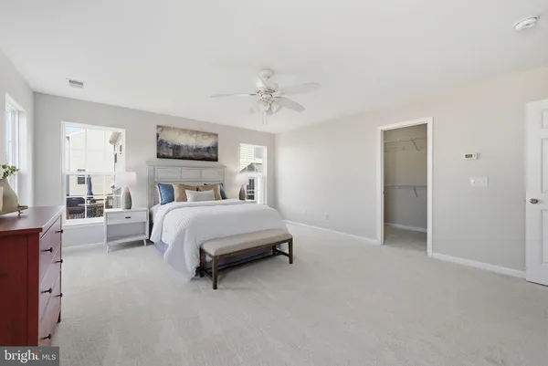 a bed room with a bed and a window