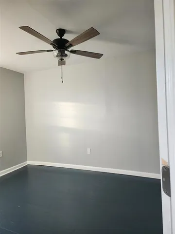 a view of a small space with wooden floor