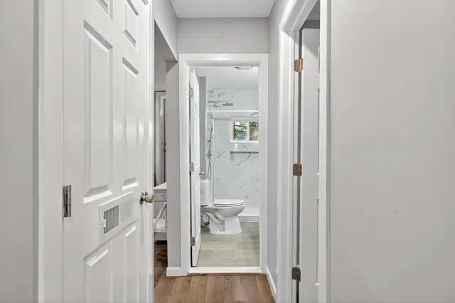 a bathroom with a glass door shower