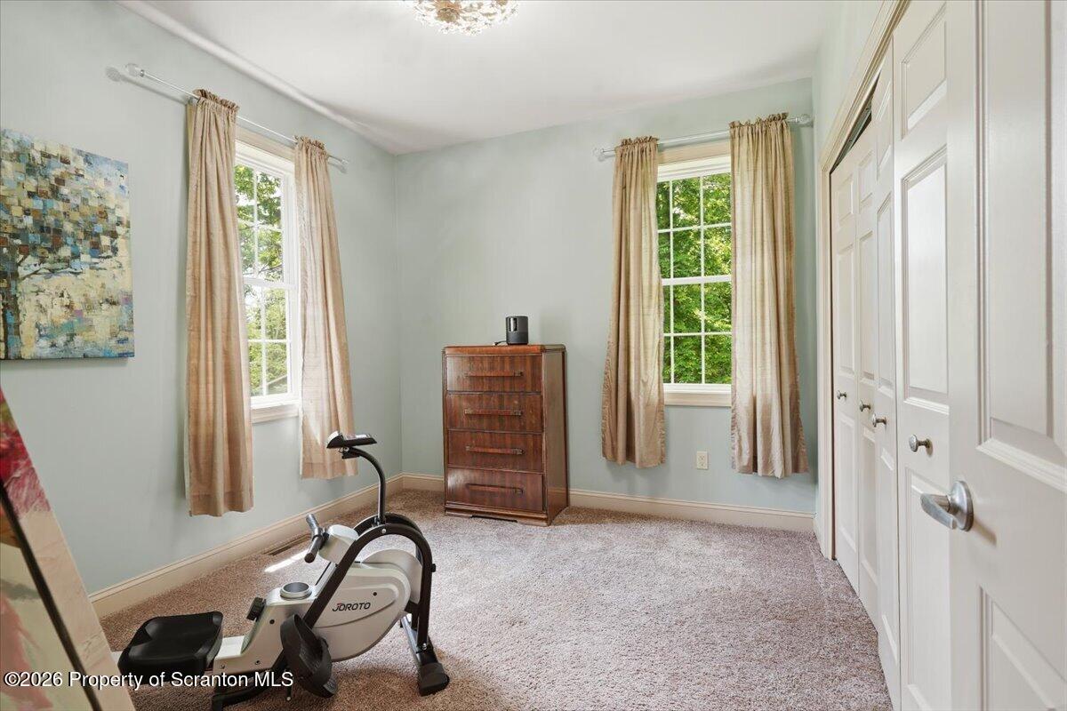 99 Hilltop Road Waverly, PA 18471 - Photo 24 of 41 a view of a room with gym equipment