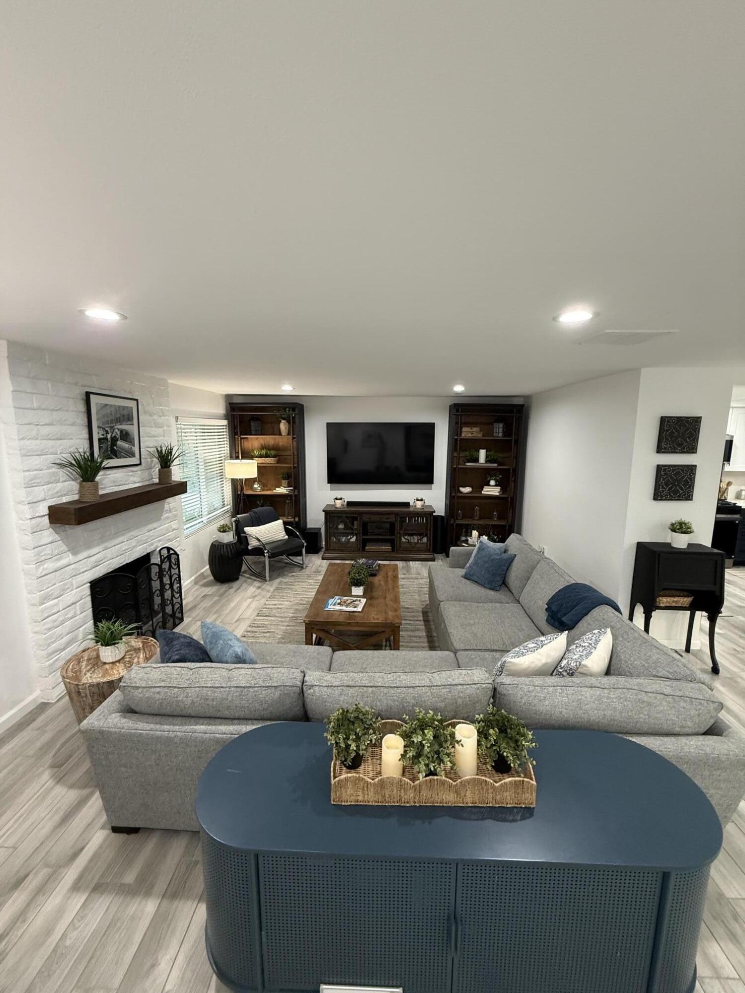 37081 Palmdale Road Rancho Mirage, CA 92270 - Photo 10 of 46 a living room with furniture and a fireplace