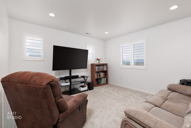 540 Lefty Lane Tooele, UT 84074 - Photo 16 of 48 Living room featuring light colored carpet and recessed lighting