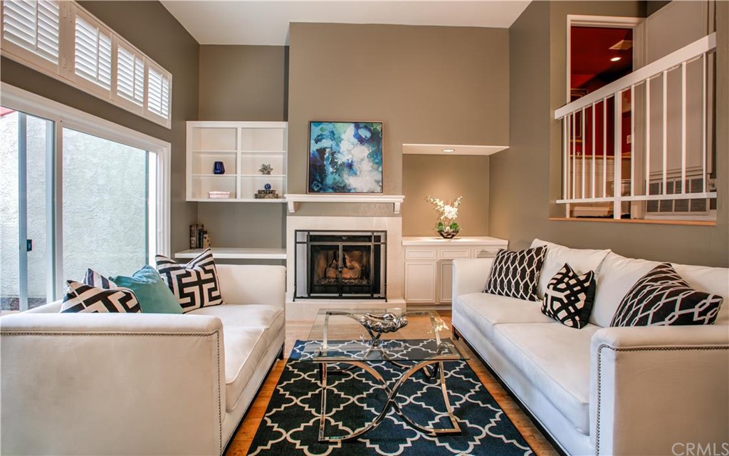 116 South Broadway, Unit D Redondo Beach, CA 90277 - Photo 1 of 1 a living room with furniture and a fireplace