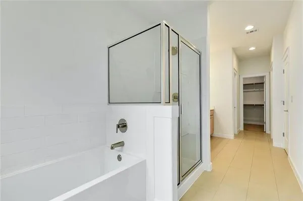 a bathroom with double sink and a mirror