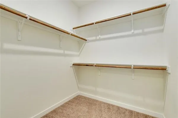 a bathroom with a granite countertop sink mirror toilet and bathtub
