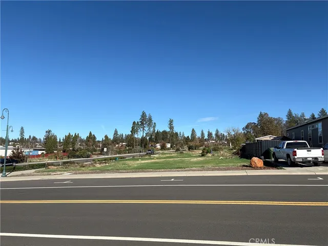 a view of a cars parked on the side of the road