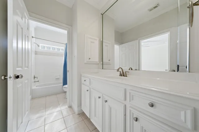 a spacious bathroom with 2 sink tub and a shower