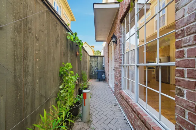 a view of a pathway besides a house