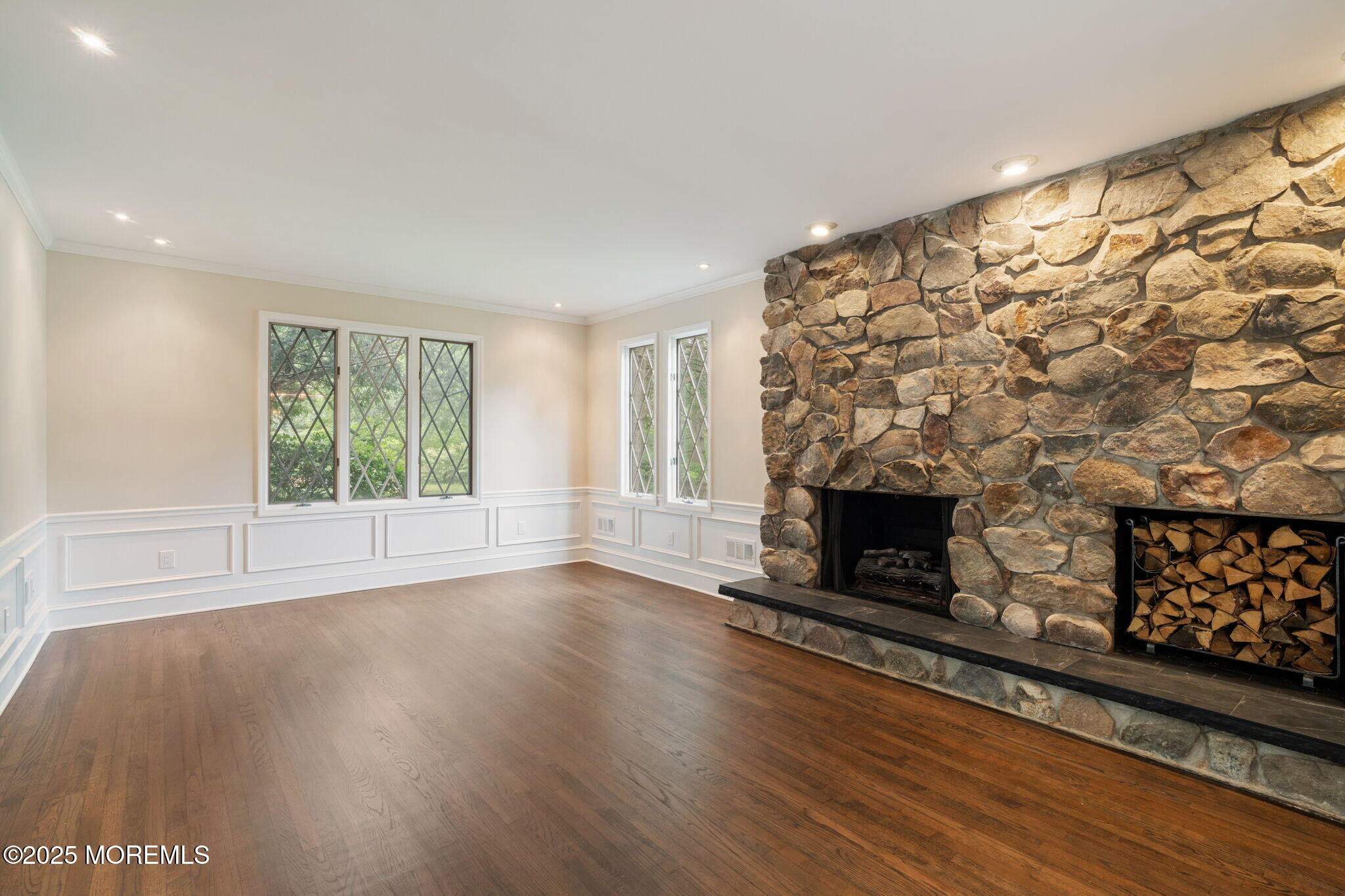 245 Borden Road Middletown, NJ 07748 - Photo 13 of 72 a view of wooden floor fire place and windows in a room