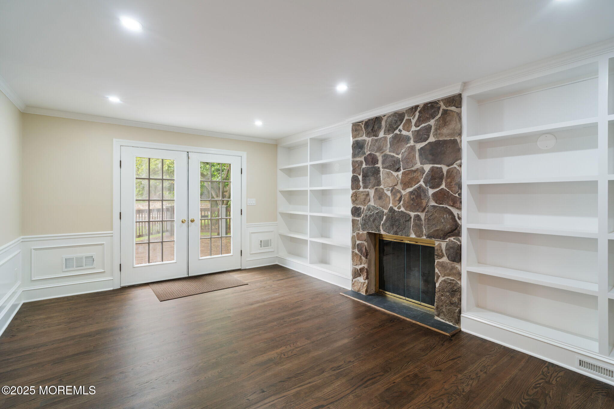 245 Borden Road Middletown, NJ 07748 - Photo 17 of 72 a view of an empty room with a fireplace and a window