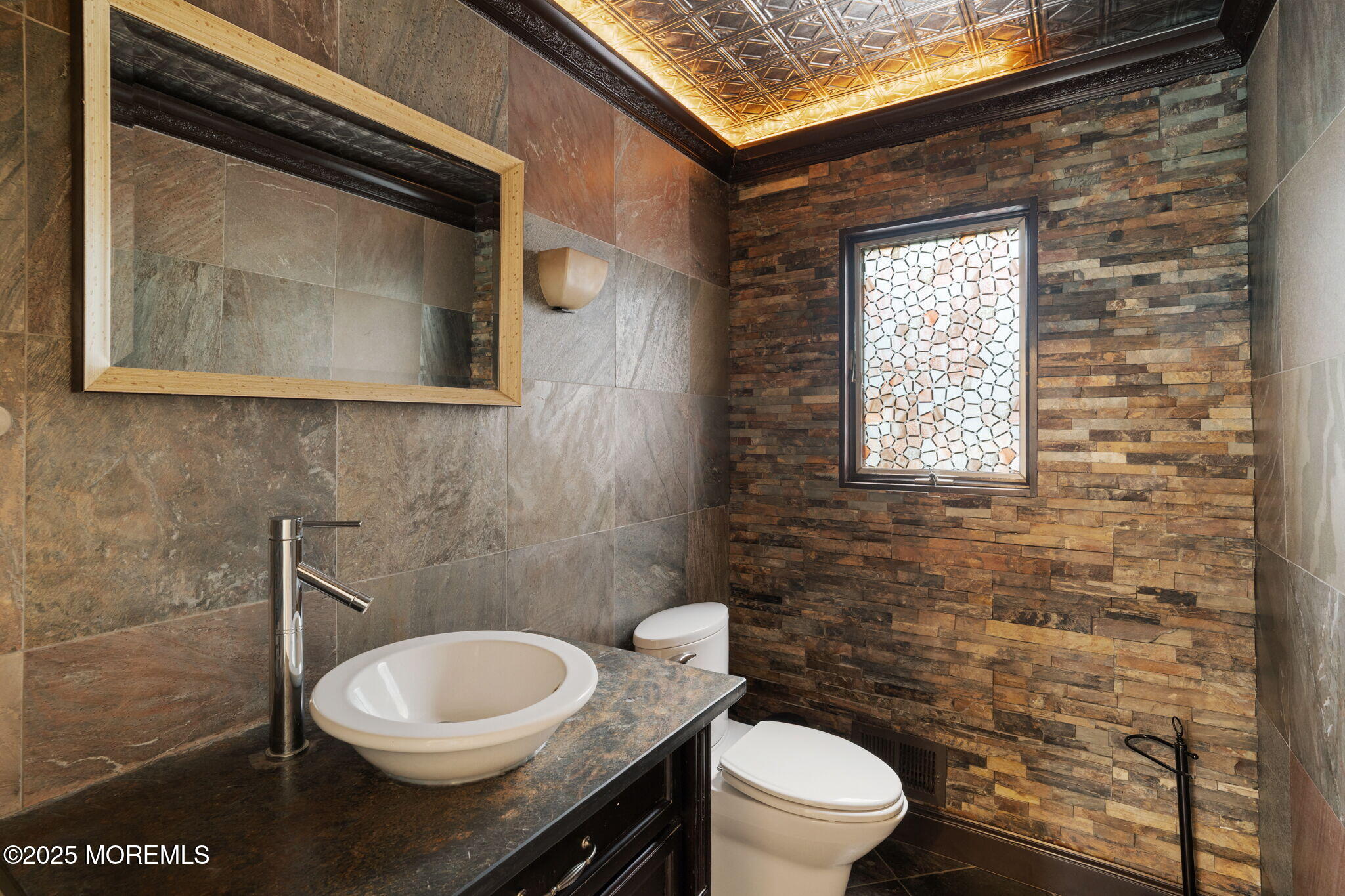 245 Borden Road Middletown, NJ 07748 - Photo 19 of 72 a bathroom with a toilet a sink and a window
