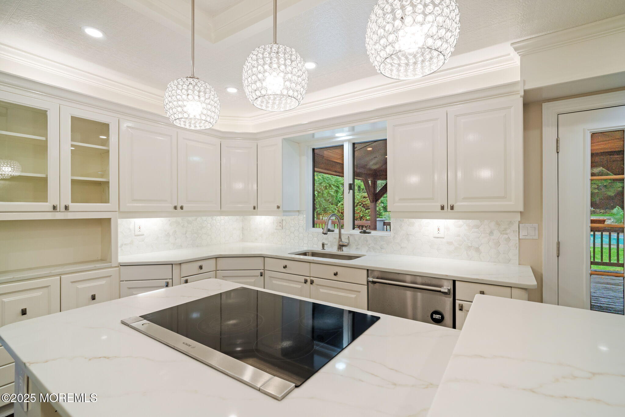 245 Borden Road Middletown, NJ 07748 - Photo 26 of 72 a kitchen with a sink a stove and chandelier