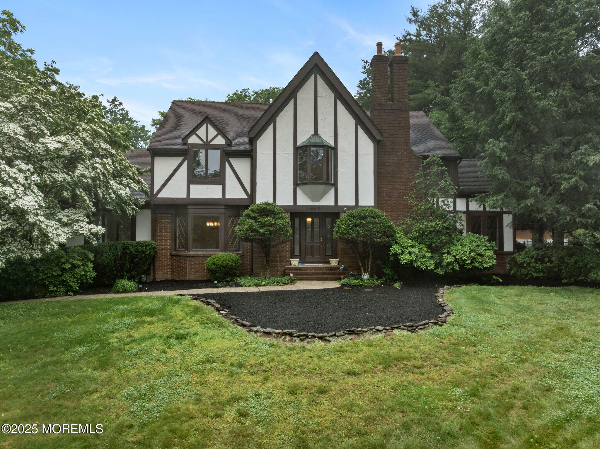 245 Borden Road Middletown, NJ 07748 - Photo 3 of 72 a front view of a house with a yard and trees