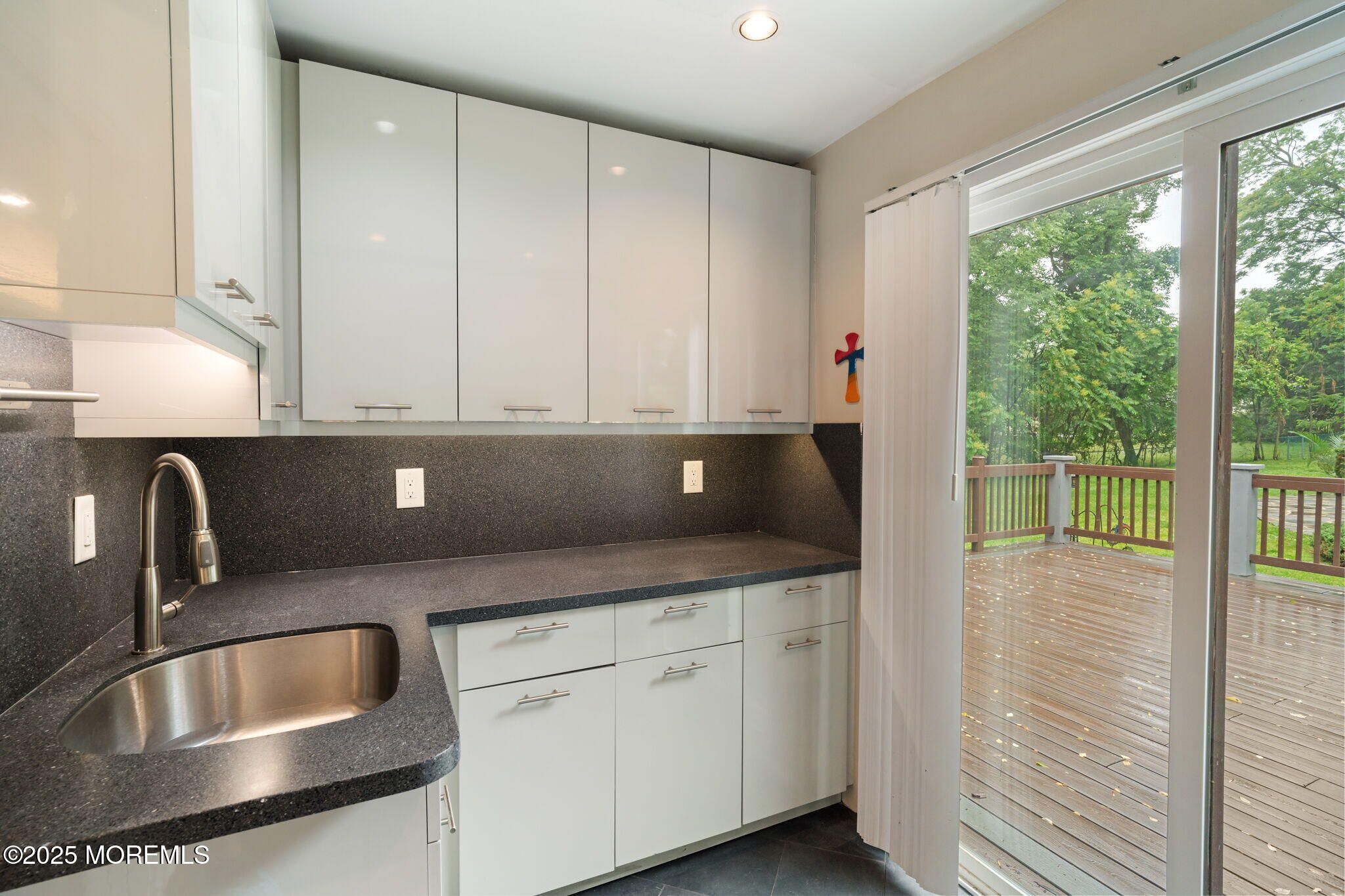 245 Borden Road Middletown, NJ 07748 - Photo 31 of 72 a kitchen with granite countertop a sink and a stove