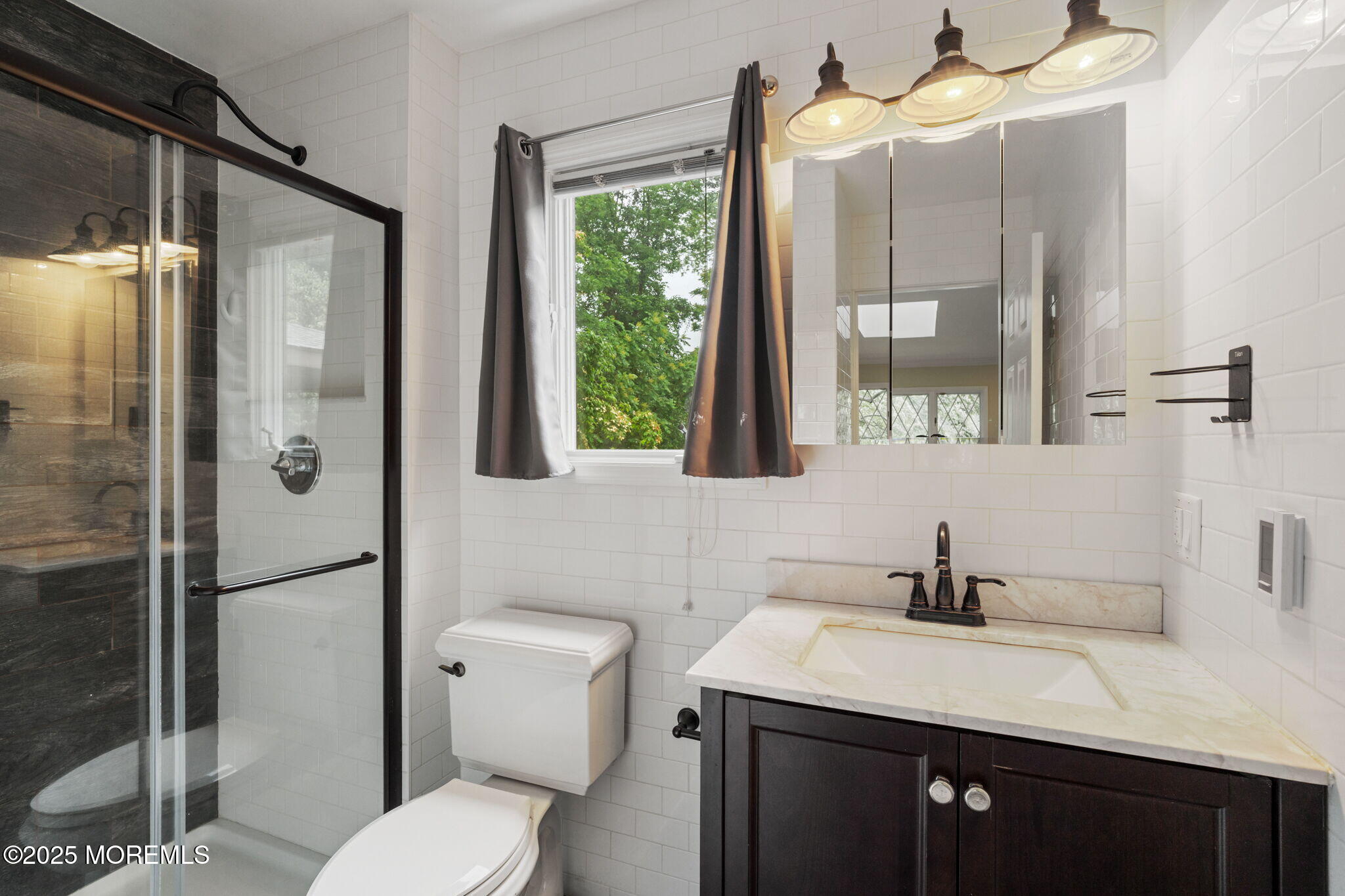 245 Borden Road Middletown, NJ 07748 - Photo 35 of 72 a bathroom with a sink toilet and shower