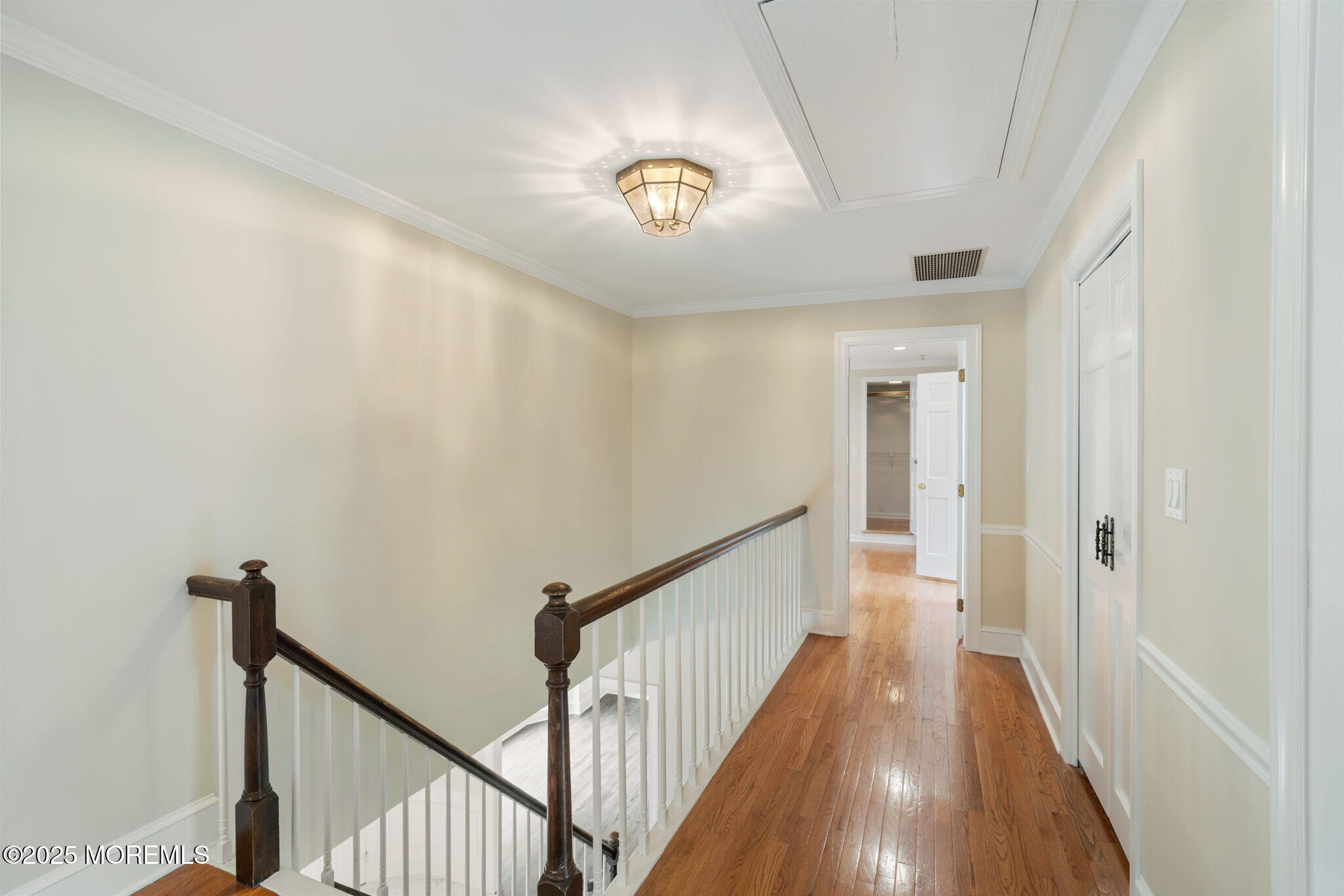 245 Borden Road Middletown, NJ 07748 - Photo 38 of 72 a view of a hallway with wooden floor and stairs
