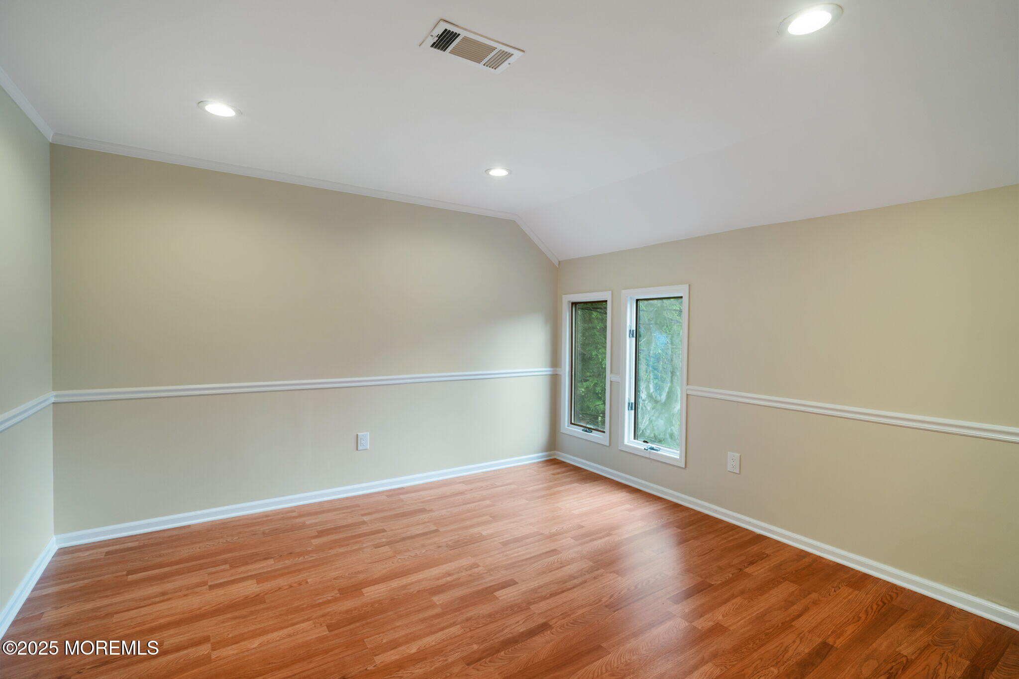245 Borden Road Middletown, NJ 07748 - Photo 45 of 72 an empty room with wooden floor and windows