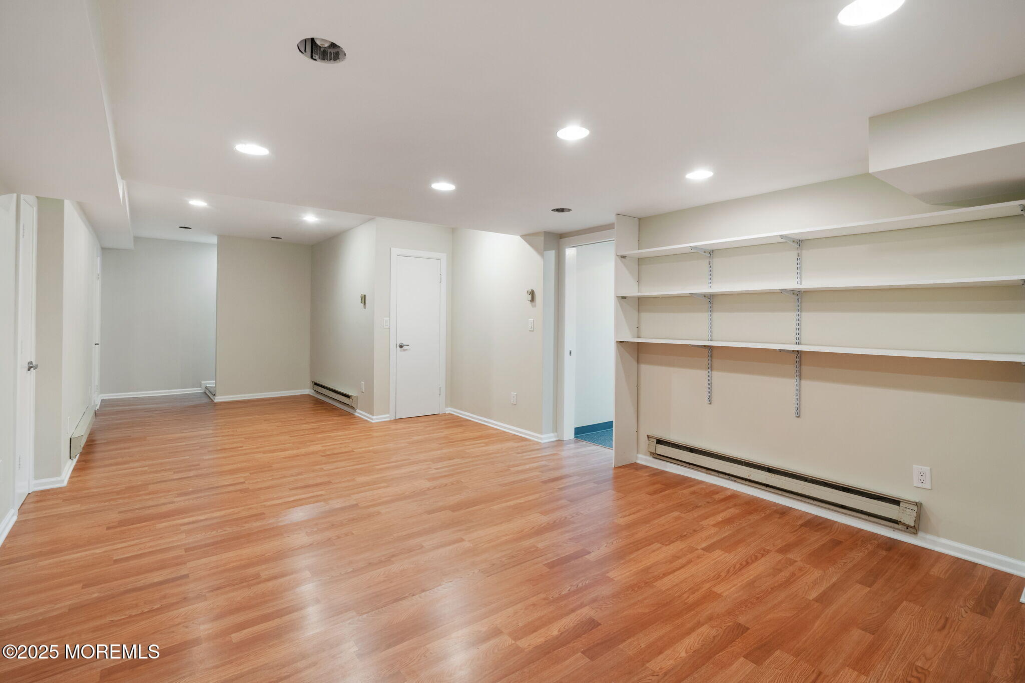 245 Borden Road Middletown, NJ 07748 - Photo 54 of 72 a view of an empty room with wooden floor and closet