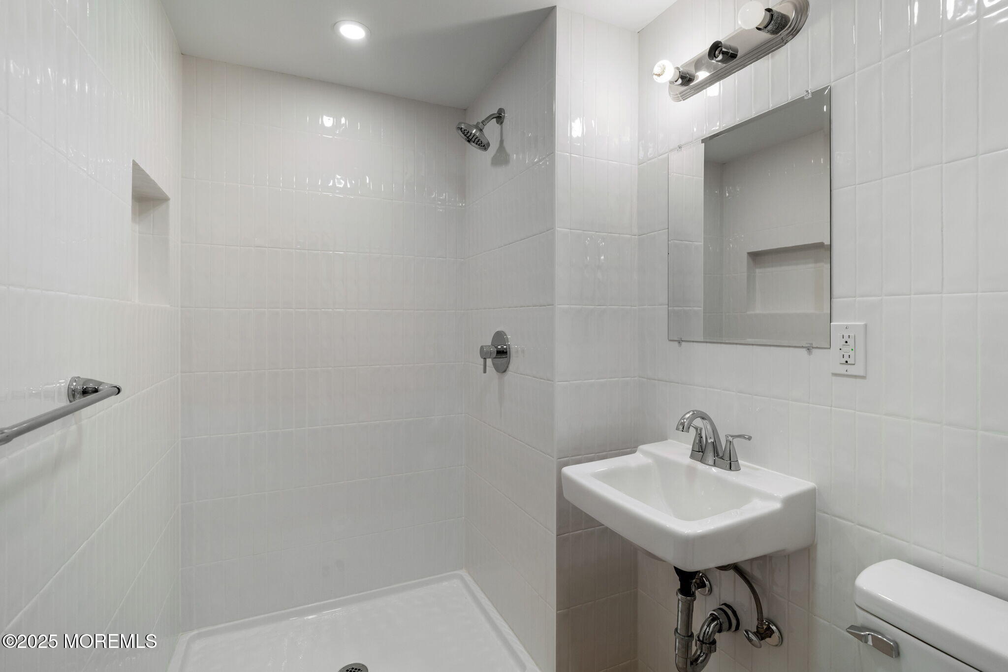 245 Borden Road Middletown, NJ 07748 - Photo 56 of 72 a bathroom with a sink a toilet and shower