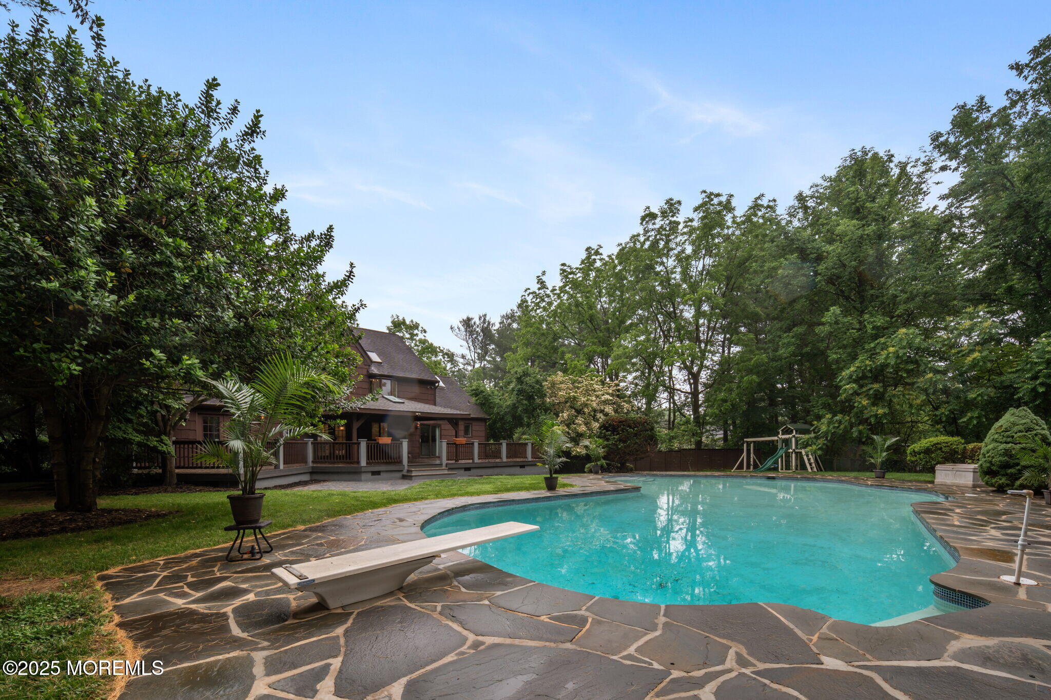 245 Borden Road Middletown, NJ 07748 - Photo 63 of 72 a view of a swimming pool with a yard