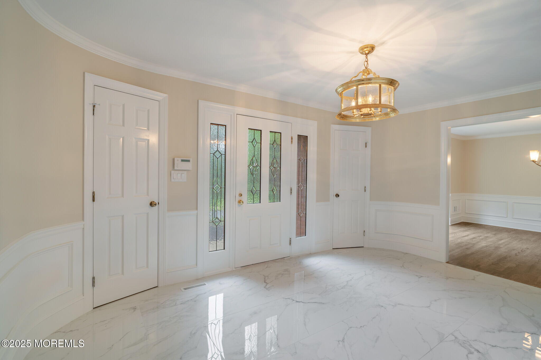 245 Borden Road Middletown, NJ 07748 - Photo 10 of 72 a view of empty room with wooden floor and chandelier