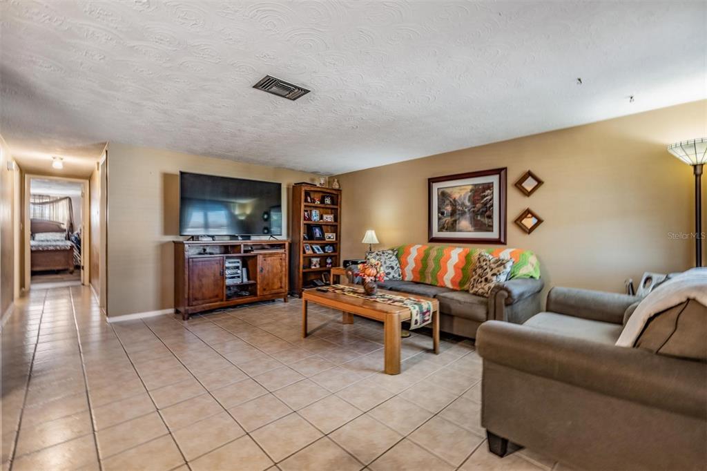 3608 Umber Road Holiday, FL 34691 - Photo 3 of 20 a living room with furniture and kitchen view