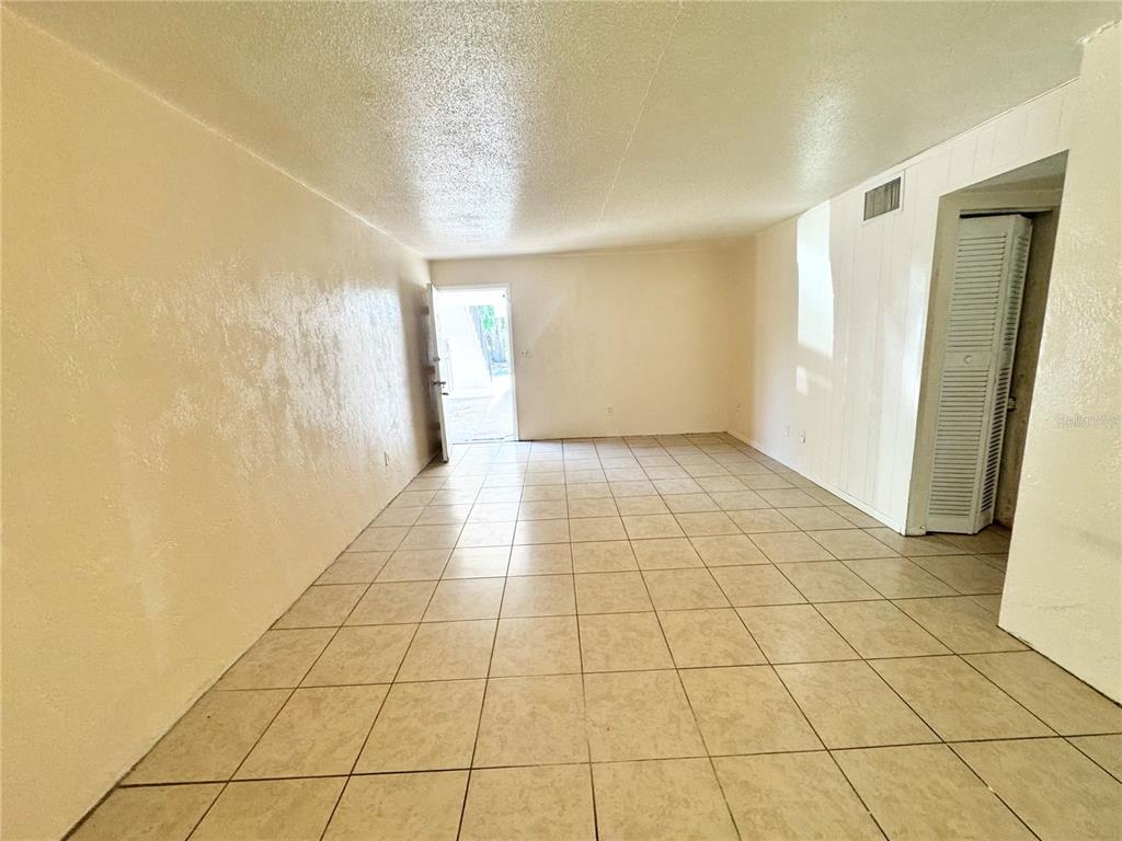 1229 Kennedy Road, Unit 43 Daytona Beach, FL 32117 - Photo 4 of 9 a view of an empty room and a window
