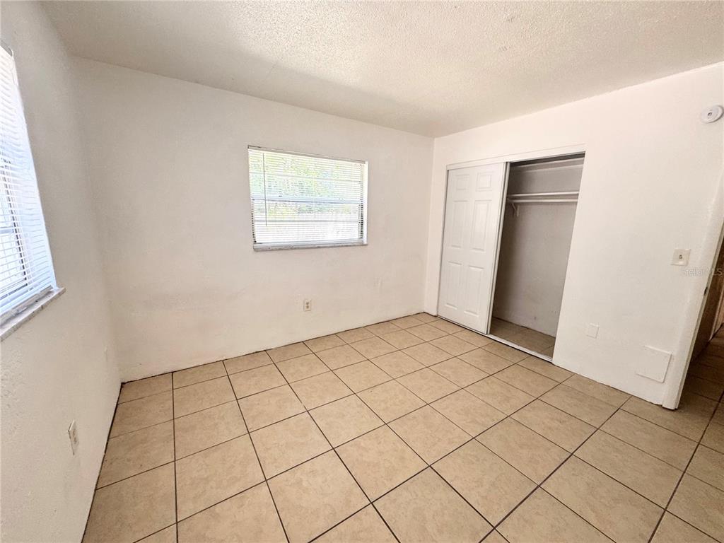 1229 Kennedy Road, Unit 43 Daytona Beach, FL 32117 - Photo 7 of 9 an empty room with windows
