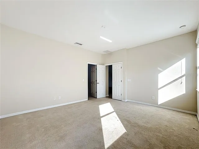 a bathroom with a tub a sink and mirror