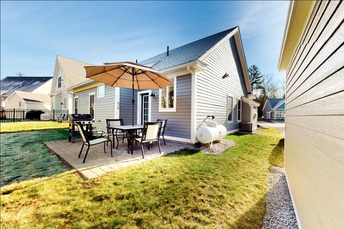55 Frontier Way, Unit 184 Arundel, ME 04046 - Photo 5 of 54 Back Patio with propane line