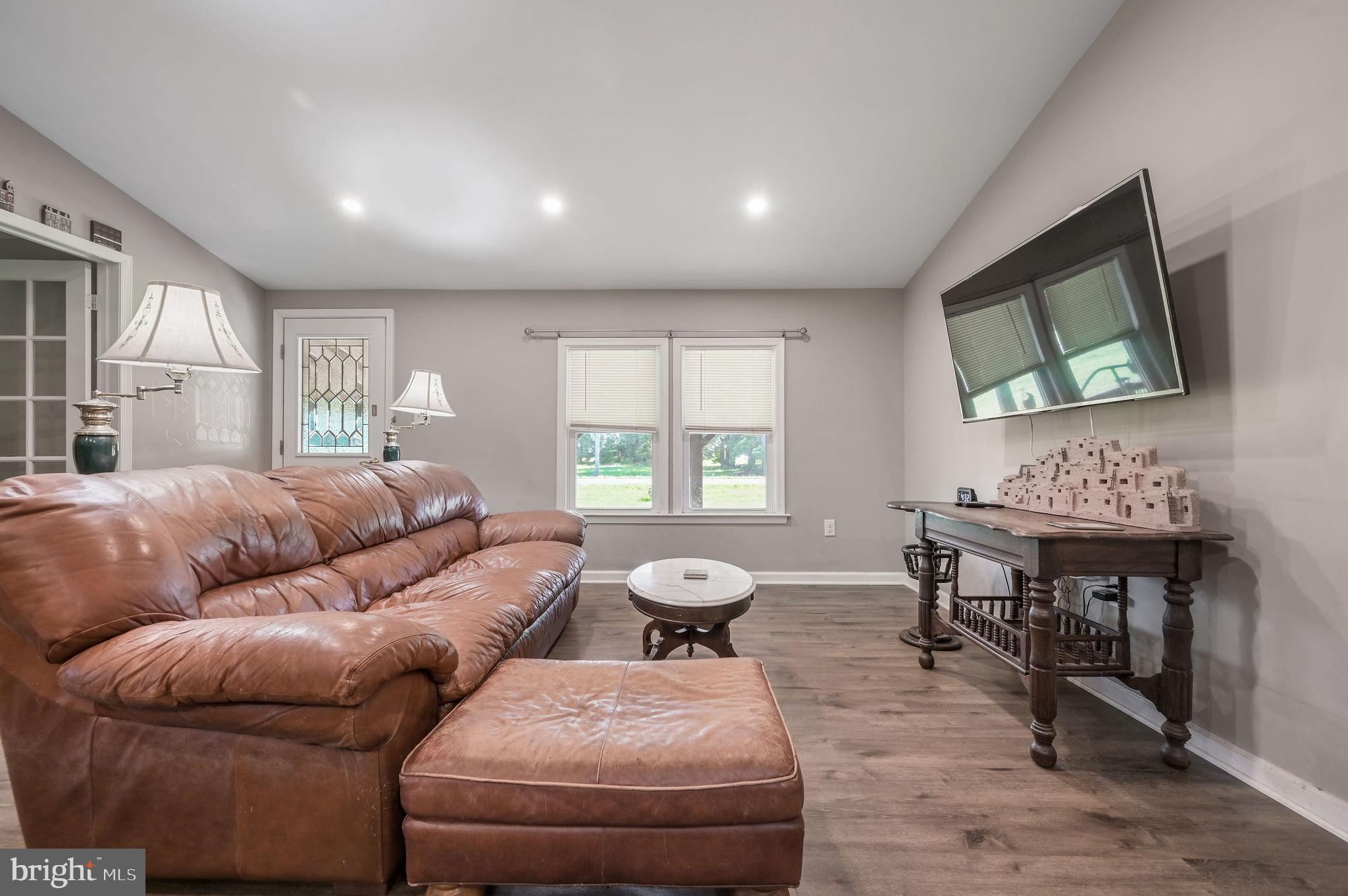 2821 Sandtown Road Felton, DE 19943 - Photo 11 of 26 a living room with furniture and a flat screen tv