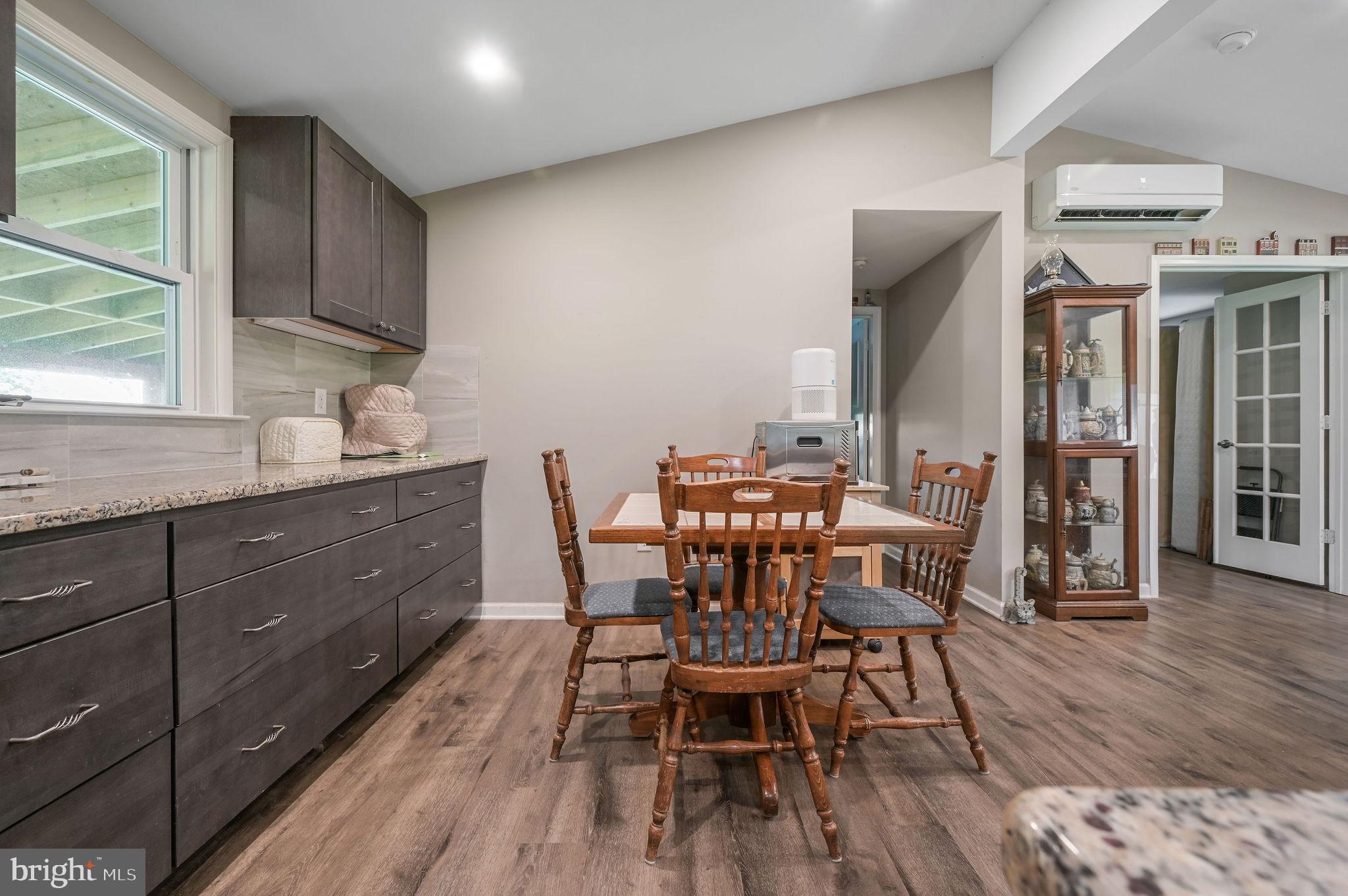 2821 Sandtown Road Felton, DE 19943 - Photo 15 of 26 a view of a dining room with furniture and wooden floor