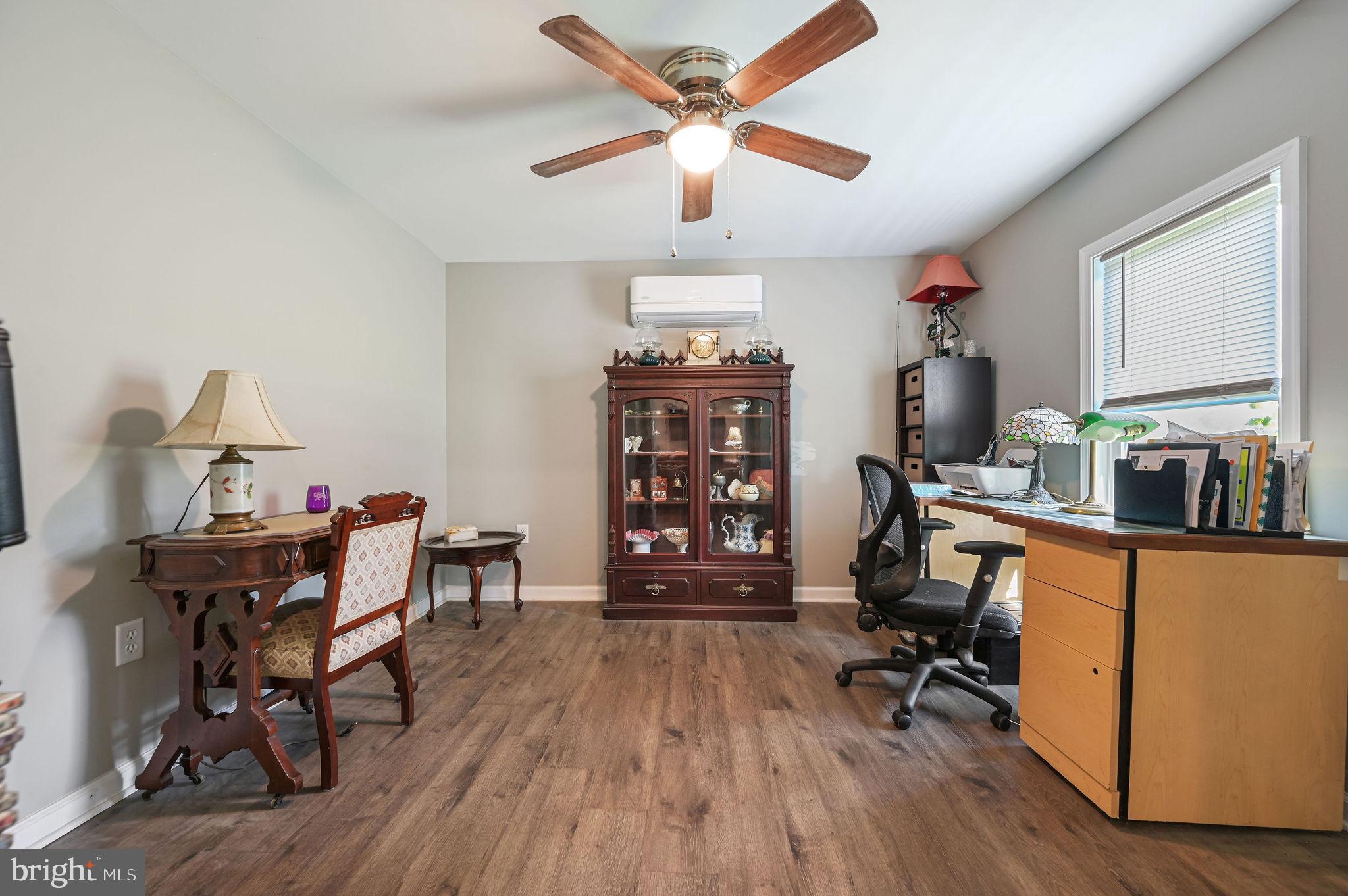 2821 Sandtown Road Felton, DE 19943 - Photo 20 of 26 a view of a workspace with furniture and a window