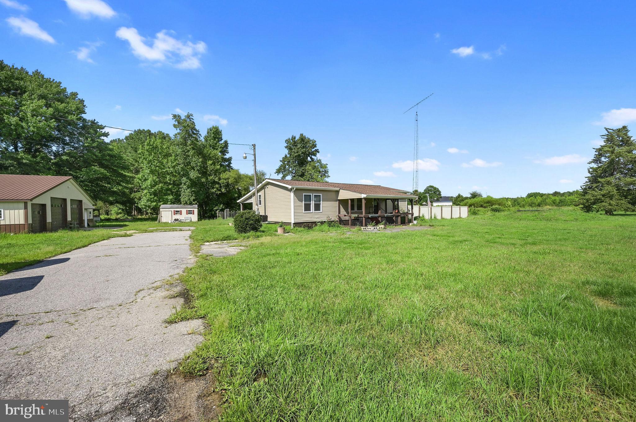 2821 Sandtown Road Felton, DE 19943 - Photo 2 of 26 a front view of a house with garden