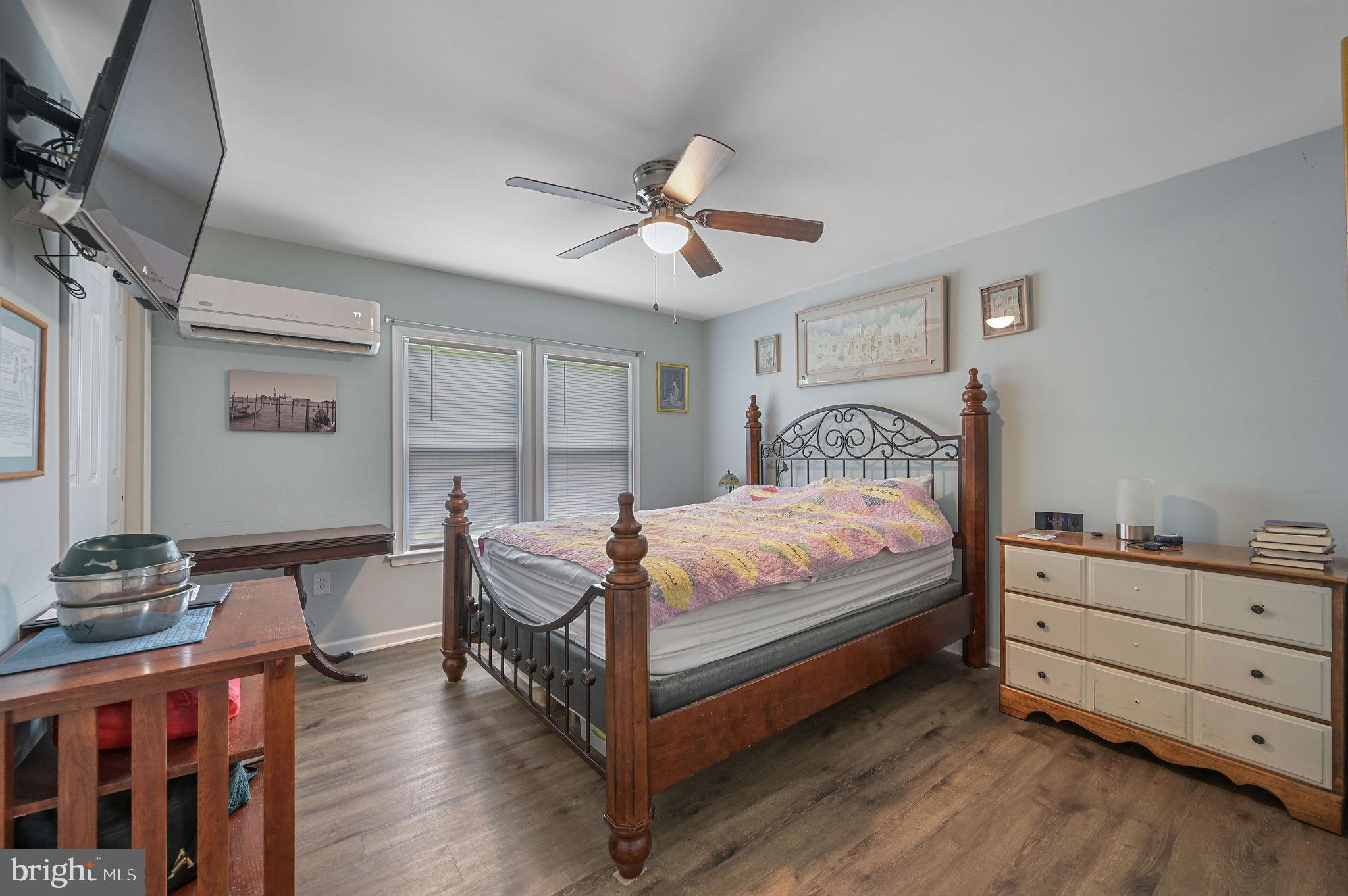 2821 Sandtown Road Felton, DE 19943 - Photo 23 of 26 a bedroom with a bed and wooden floor