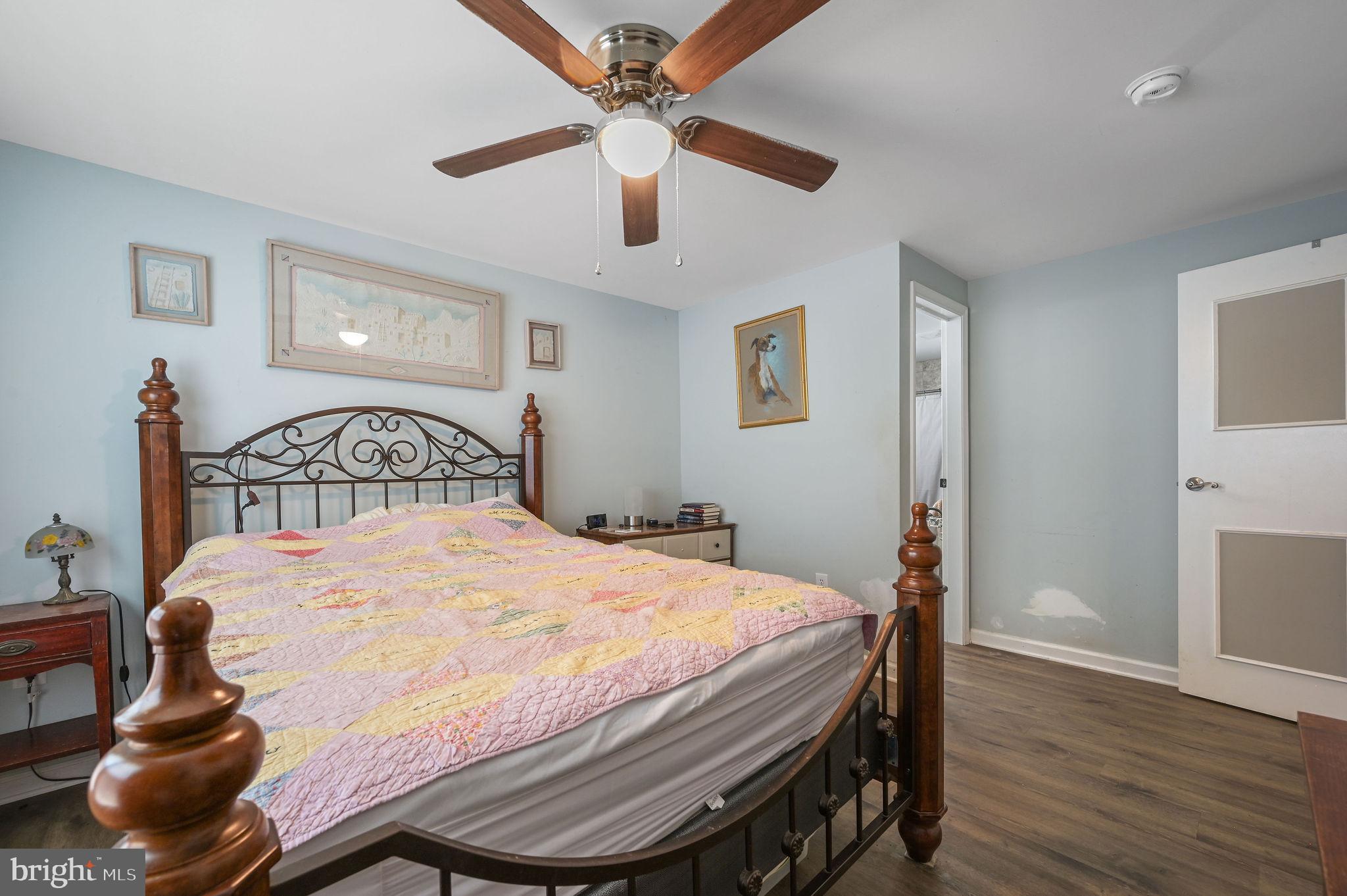 2821 Sandtown Road Felton, DE 19943 - Photo 24 of 26 a bedroom with a bed and wooden floor