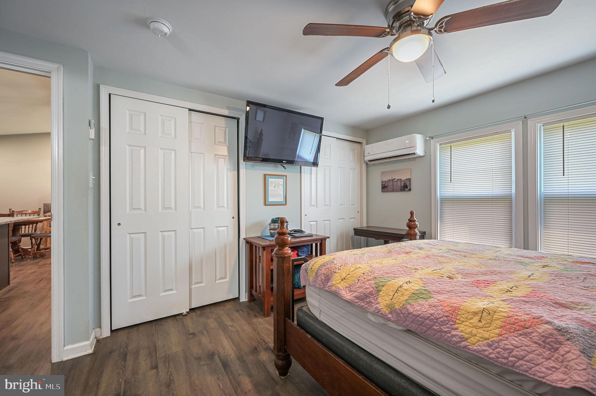 2821 Sandtown Road Felton, DE 19943 - Photo 25 of 26 a bedroom with a bed and a chandelier